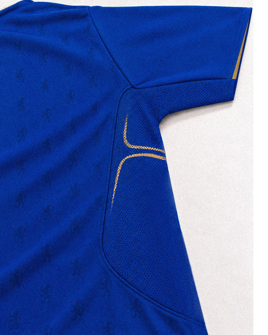 Breathable underarm mesh panel and gold accent close-up