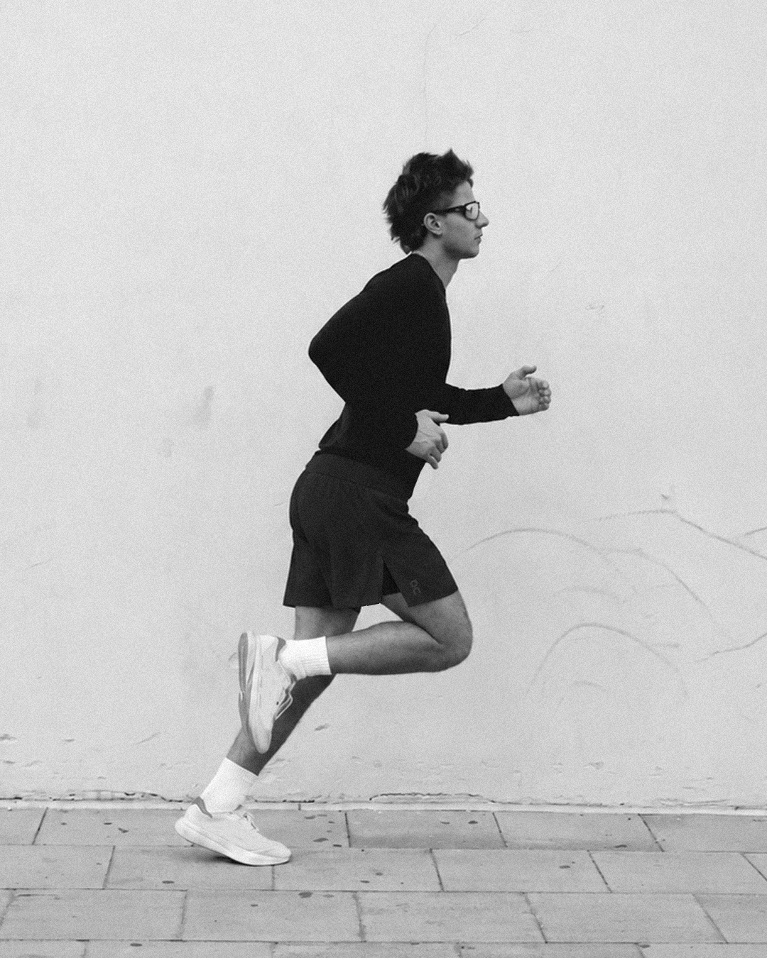 Runner wearing the black two-in-one running shorts